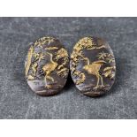 A Japanese Meiji shakudo brooch,, 42 x 29mm.