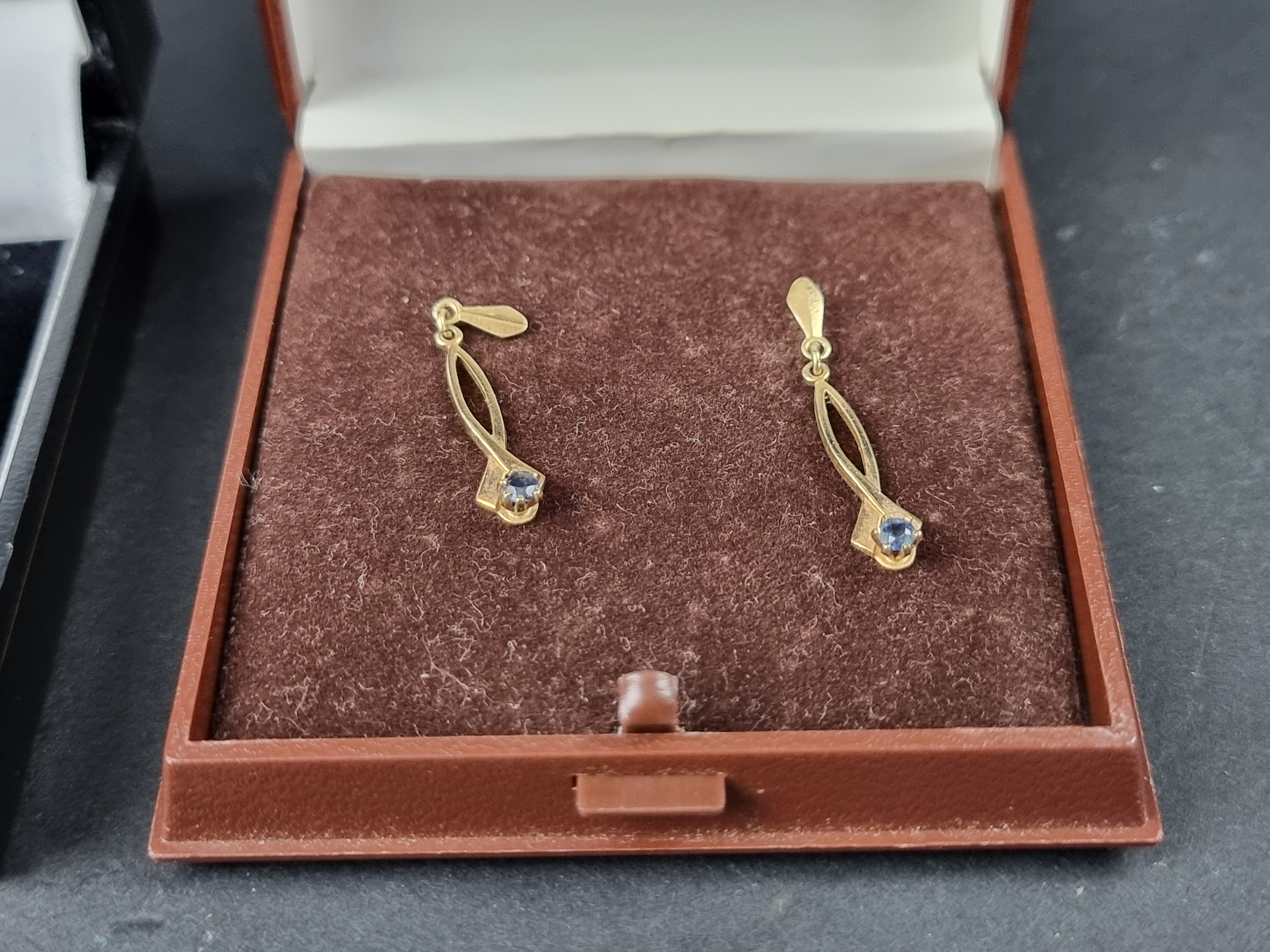 A pair of 9ct gold blue topaz earrings; together with another pair of 9ct gold blue gem set - Image 5 of 5