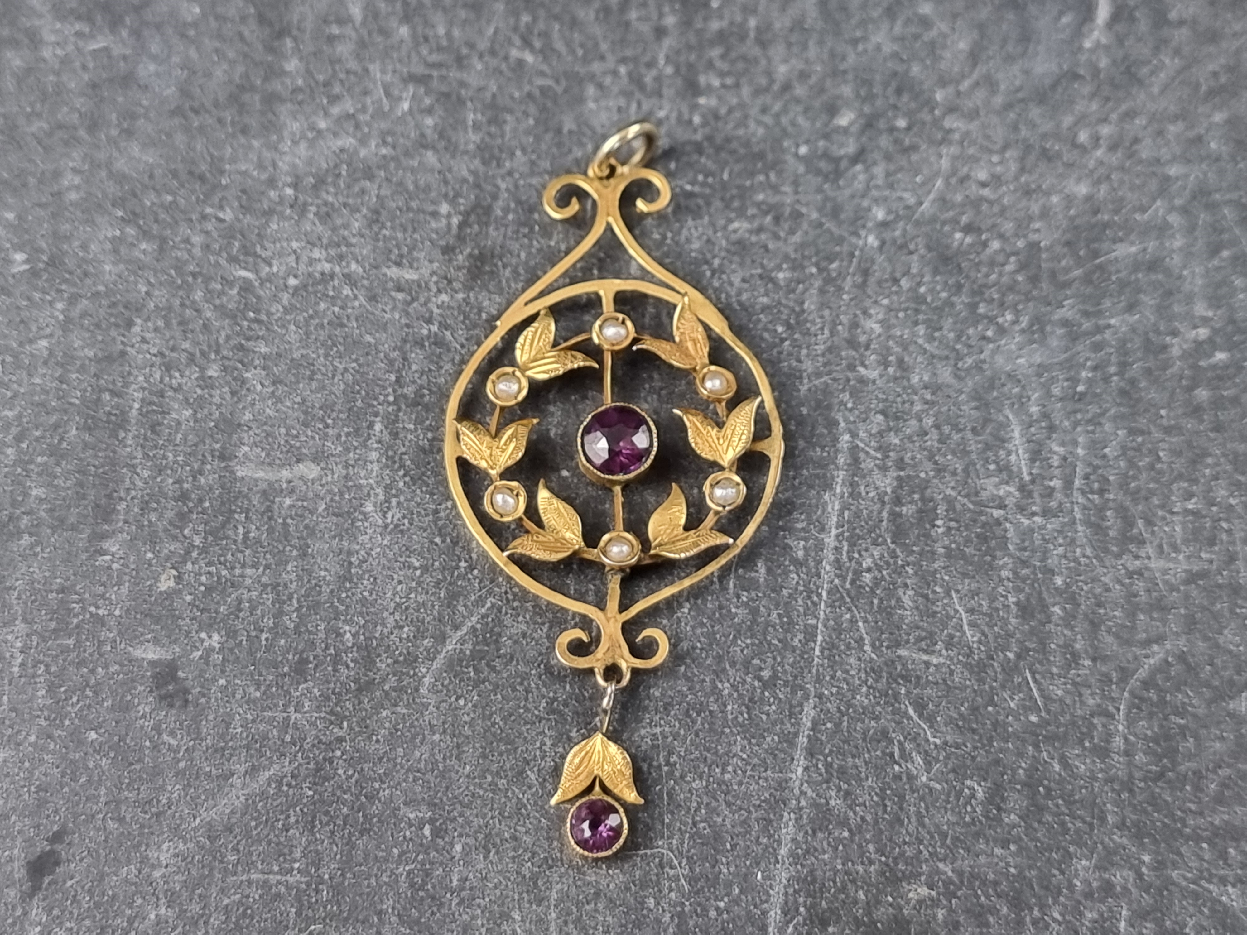 A late Victorian yellow metal, amethyst and pearl pendant, 46mm high.