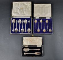 A cased set of six picture back teaspoons, by Thomas Bradbury & Sons Ltd, London 1927; together with
