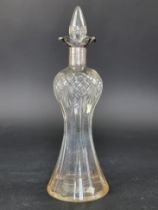 A silver mounted cut glass decanter and stopper, by William Hutton & Sons Ltd, Birmingham 1924, 34.