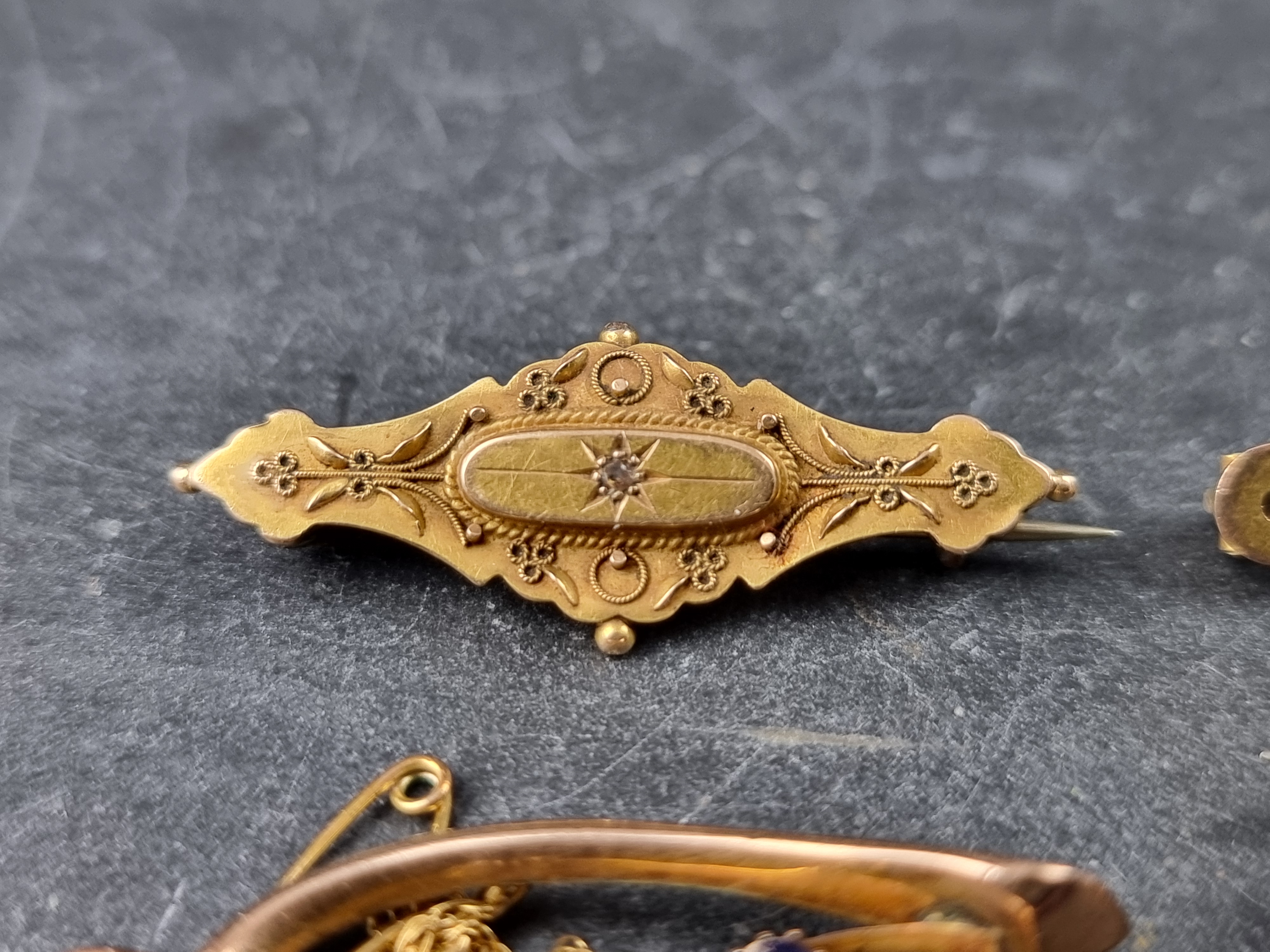 A Victorian yellow metal bar brooch, set mine cut diamond to centre, stamped 15ct, with metal - Image 2 of 5