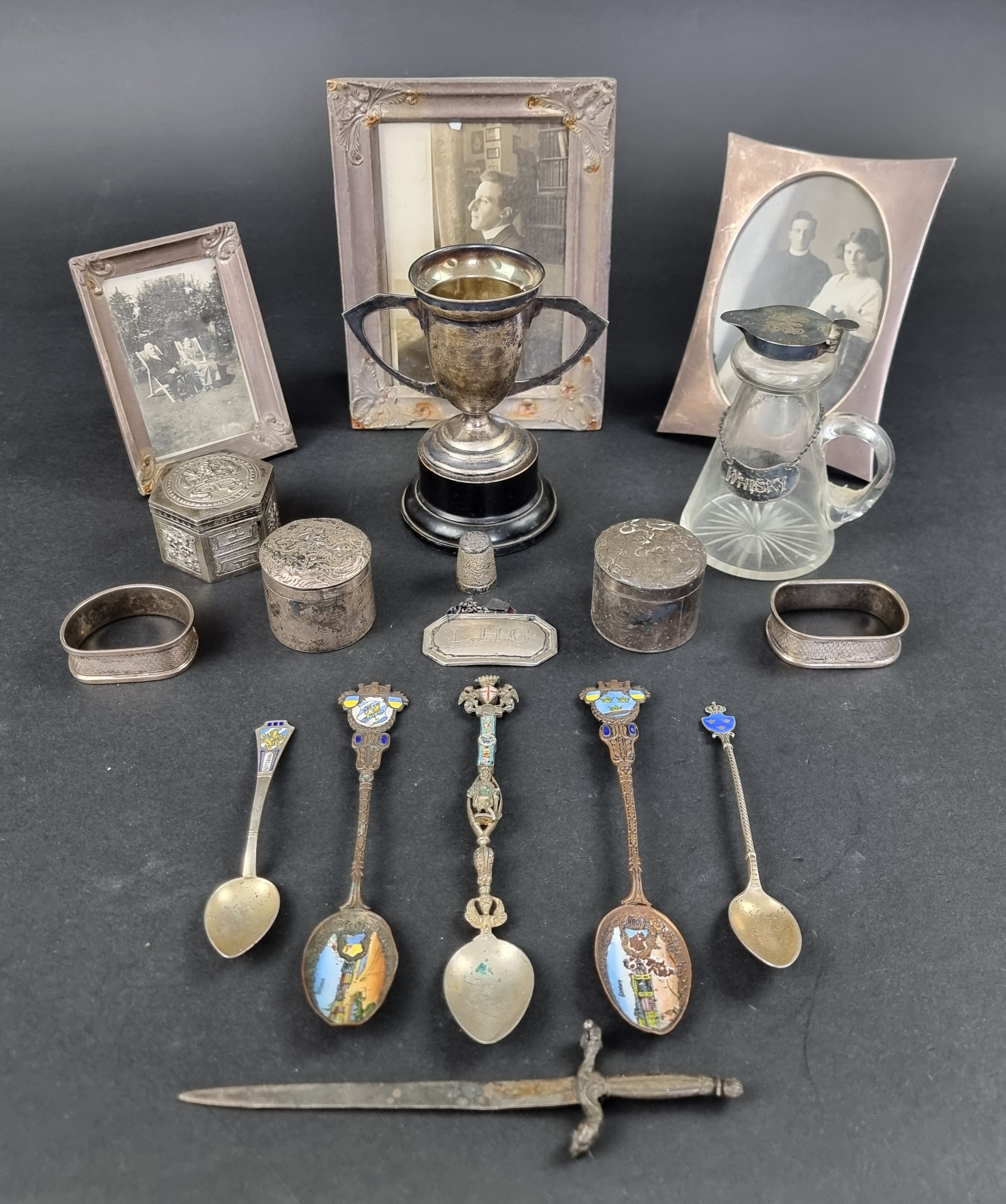 A group of silver and white metal items; to include three photograph frames; a silver mounted