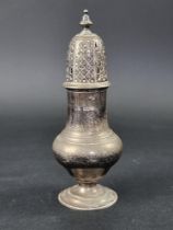 A silver sugar caster, by Josiah Williams & Co, London 1919, 22cm high, 234g.