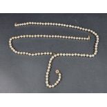 A pearl necklace, having yellow metal clasp, 69cm long; together with another similar necklace,