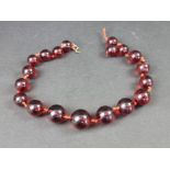 An amber style bead necklace, 44cm long.