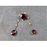A garnet and pearl set pendant necklace, stamped 9c.