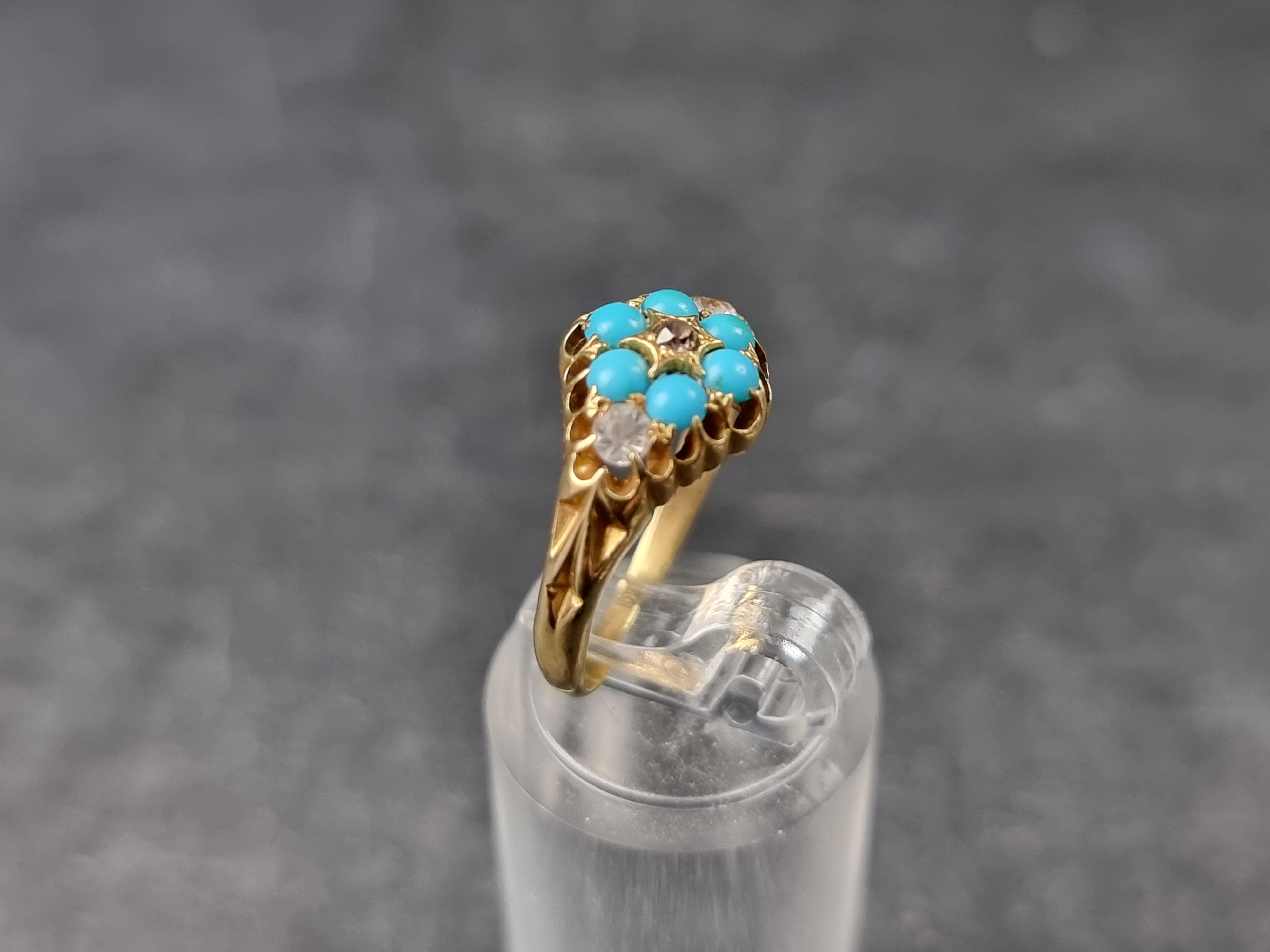 A Victorian yellow metal ring, set one diamond, two colourless gemstones and six cabochon turquoise, - Image 3 of 3