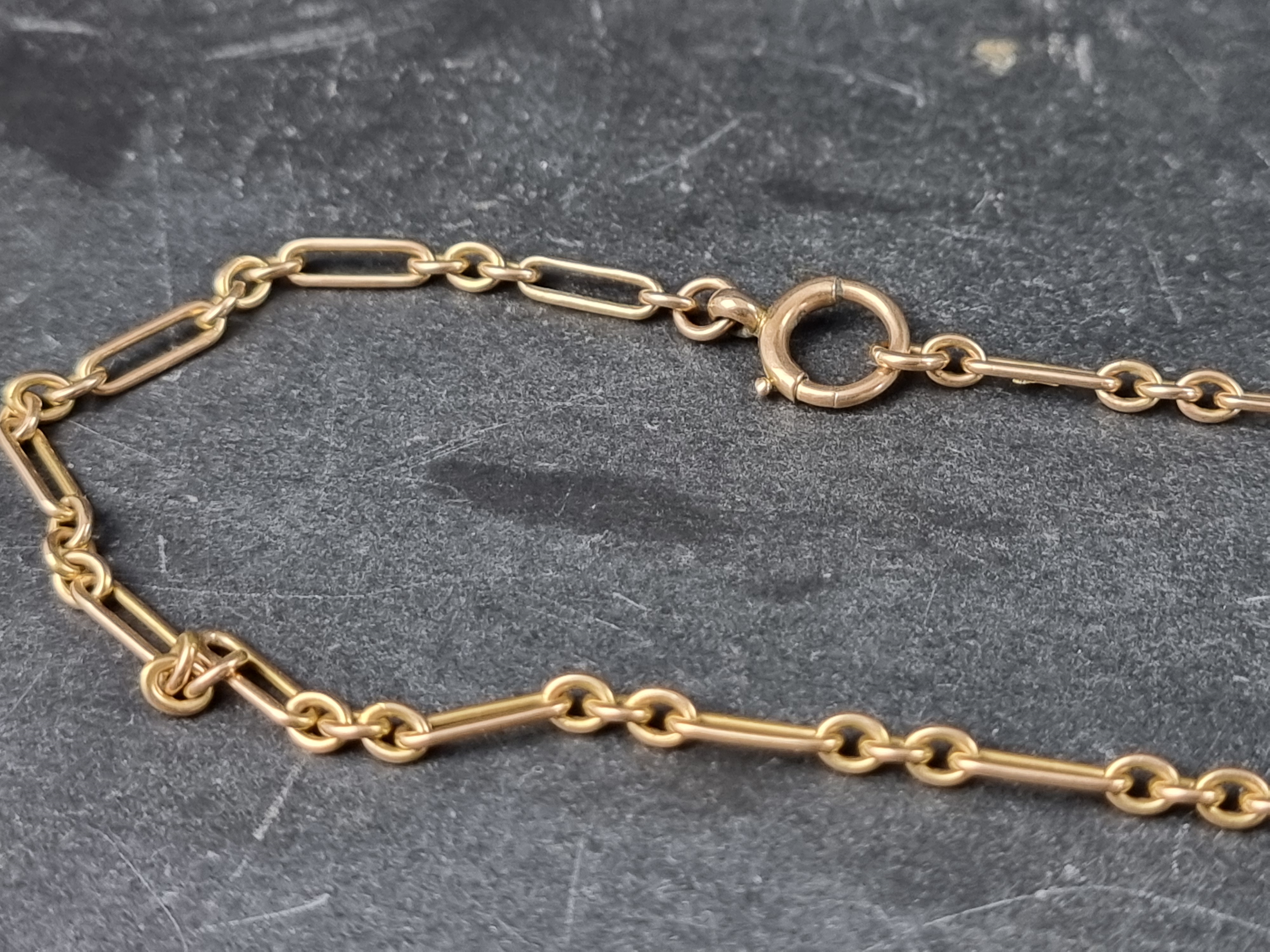 A Victorian yellow metal trombone link longuard necklace, marked 15ct, 144cm long. - Image 2 of 2