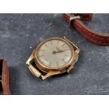 A Longines 9ct gold manual wind ladies wristwatch, 21mm, with brown leather strap.