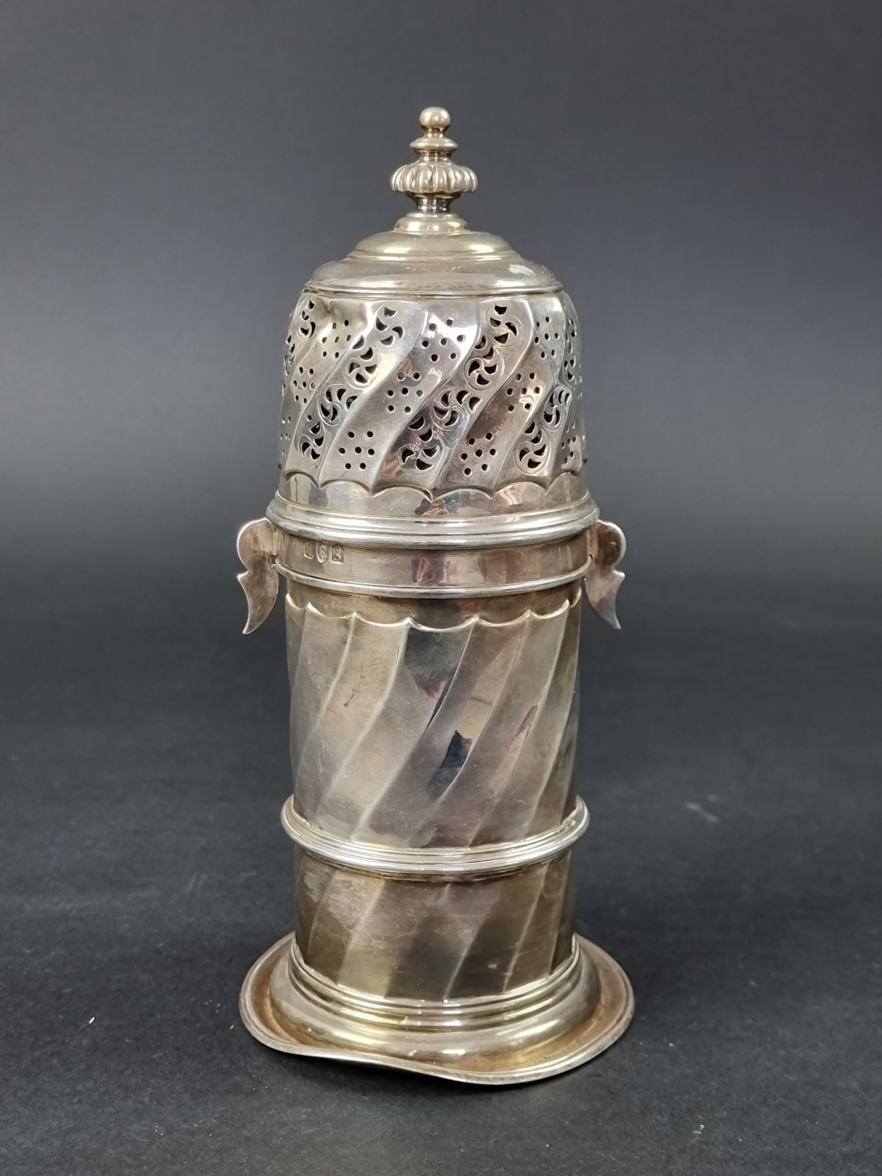 An unusual silver sugar caster, by Charles Stuart Harris, London 1892, 21cm high, 354g.