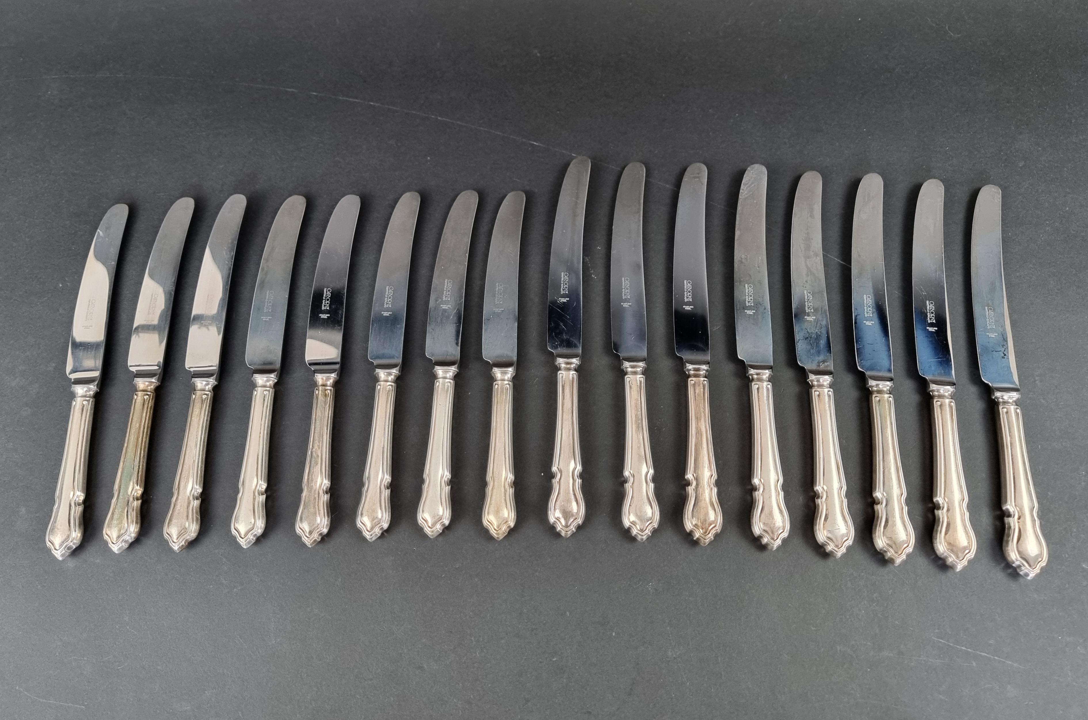 A set of eight EPNS Dubarry pattern table knives and matching dessert knives, by John Osborne of