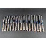 A set of eight EPNS Dubarry pattern table knives and matching dessert knives, by John Osborne of