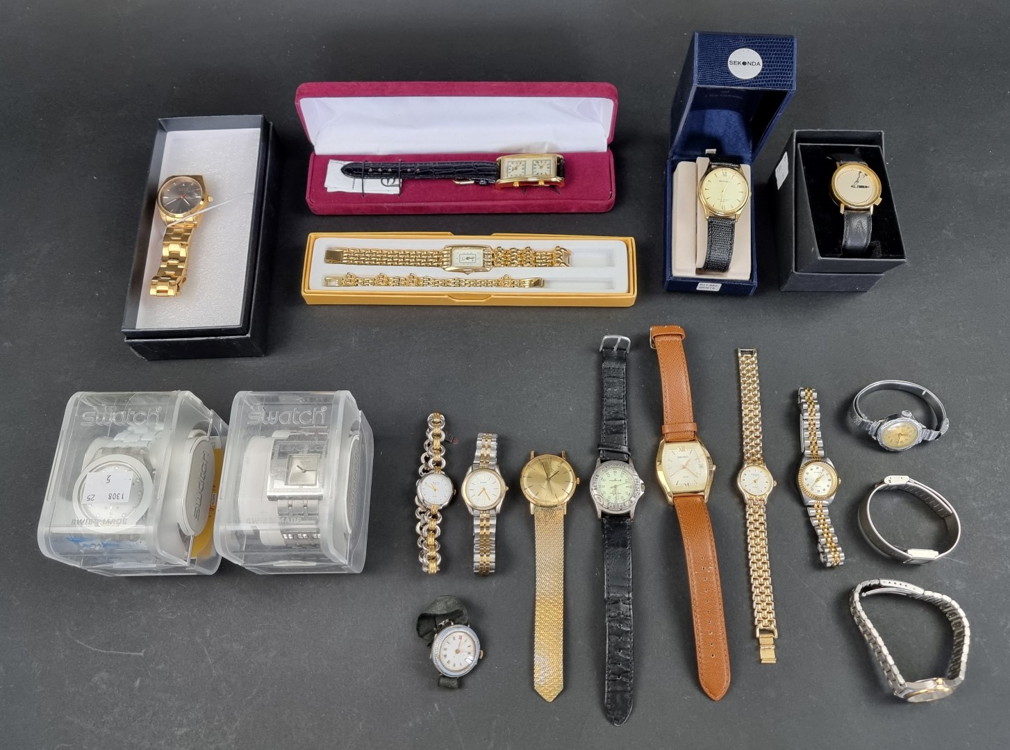 A large quantity of wristwatches, to include two boxed Swatch examples.