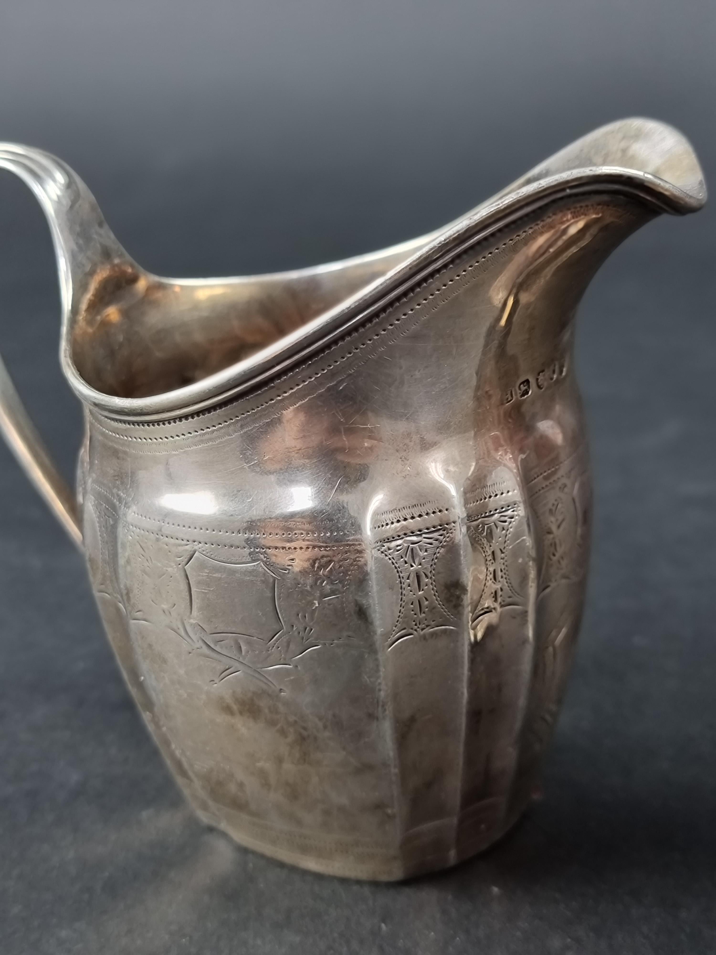 A George III silver jug, maker's mark rubbed, London 1794, height to handle 11cm; together with - Image 3 of 3