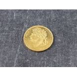 Coins: a rare George IIII 1821 gold sovereign, in near uncirculated condition.