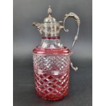 A silver mounted and cranberry stained glass claret jug, by B P Co, London 1979, 32cm high.