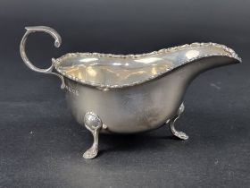 A silver sauce boat, by Robert Pringle & Sons, London, 1928, height to handle 8cm, 125g.