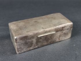 A silver cigarette box, by Charles & Richard Comyns, London 1916, engraved 'Presented to the