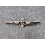 An Edwardian yellow metal sapphire and diamond brooch, stamped '15ct', 51mm wide,