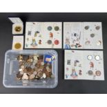 Coins: a quantity of UK and world coins; to include twelve Beatrix Potter fifty pence coins and a