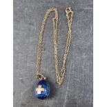 A 19th century Russian silver and enamel egg pendant, 19.5mm high, the hanging loop stamped '84',