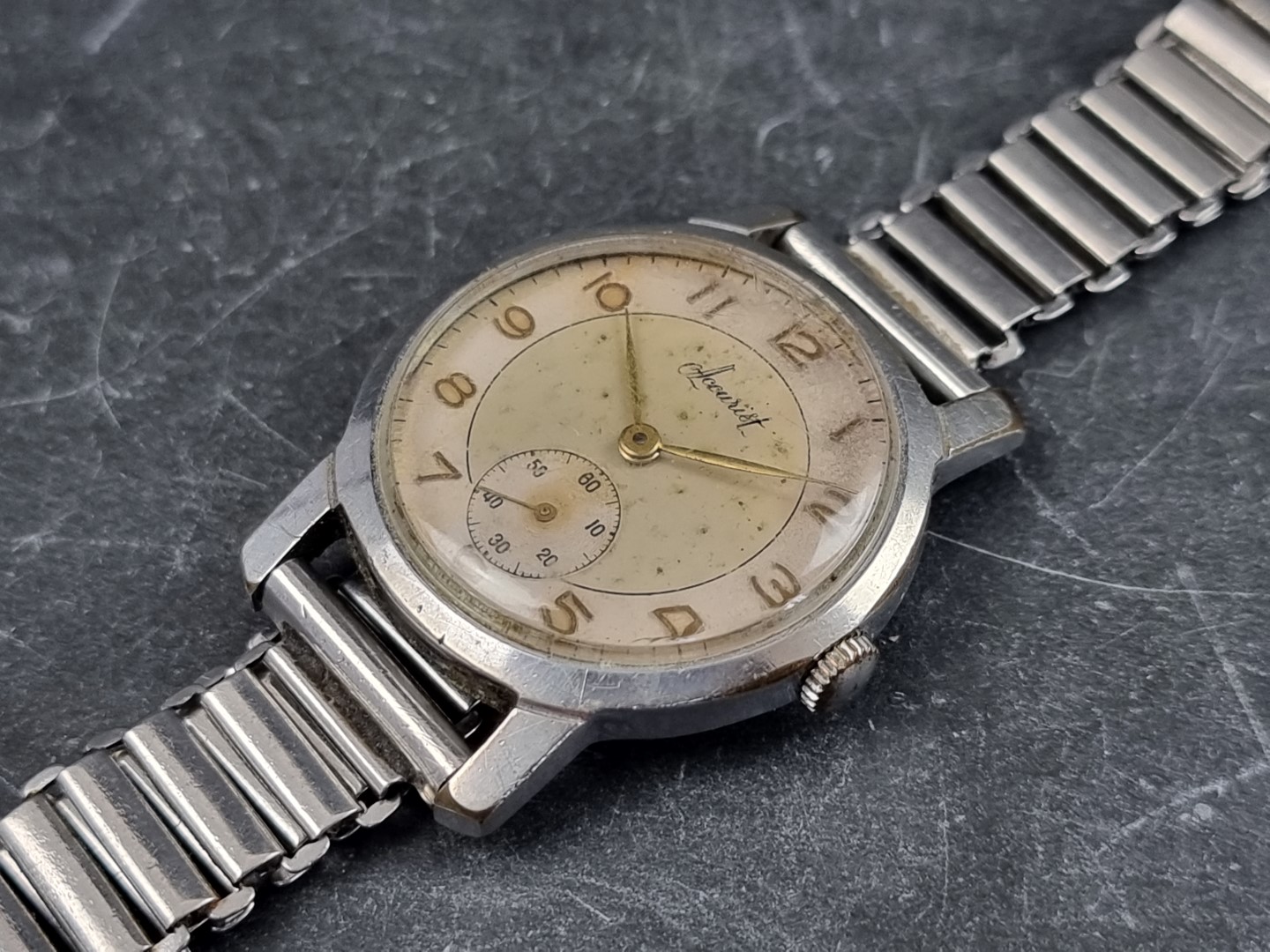 A circa 1950s Accurist stainless steel manual wind wristwatch, 32mm, on stainless steel bracelet.