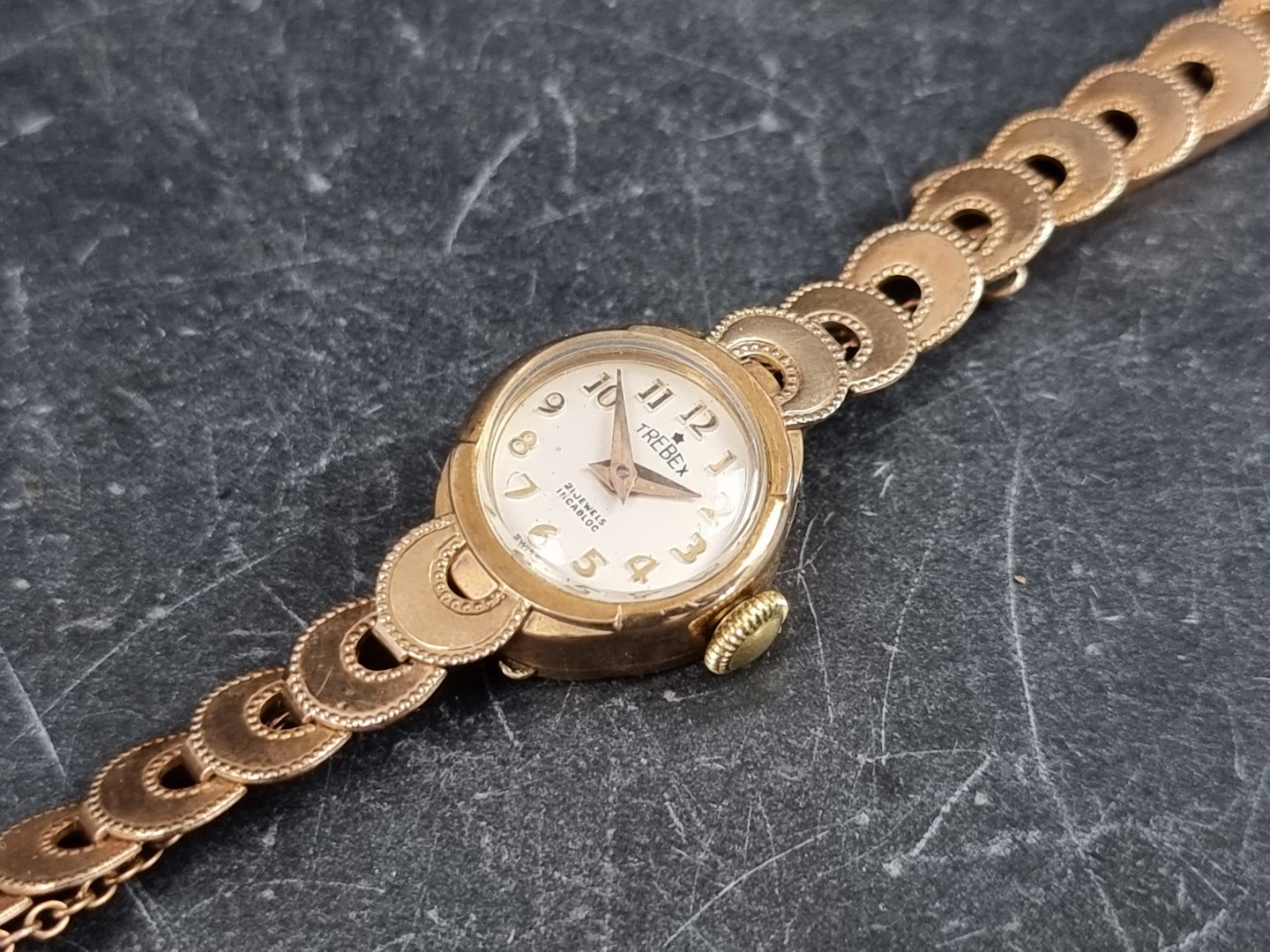 A Trebex 9ct gold manual wind ladies wristwatch, 15mm, on 9ct gold bracelet.