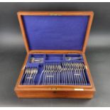 An Edwardian oak canteen of silver Old English pattern cutlery for twelve, by Josiah Williams &