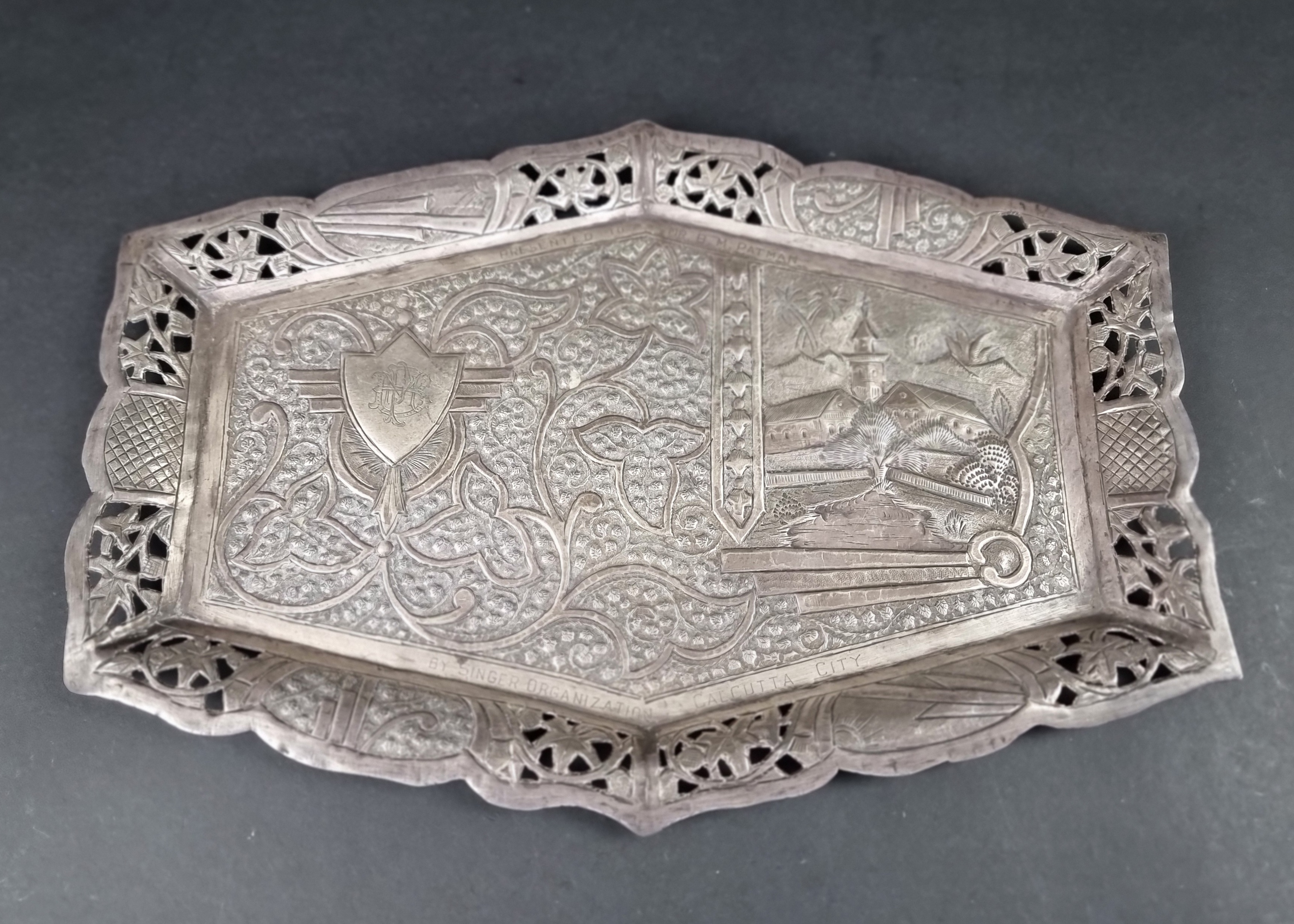 An Indian white metal tray, stamped 'T94', 35cm wide.