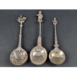 Three 19th century Dutch white metal spoons, having decorated terminals.