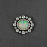 An impressive Victorian opal and diamond brooch, set central cabochon opal, estimated at 8.5ct,
