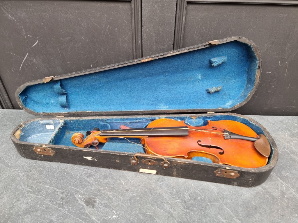 A violin, with 13in one-piece back, in ebonized case.