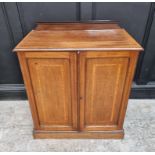 An Edwardian mahogany, satinwood crossbanded and line inlaid side cabinet, 75cm wide.