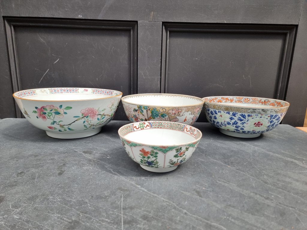 Three Chinese famille rose bowls, largest 34cm diameter; together with another Kangxi famille