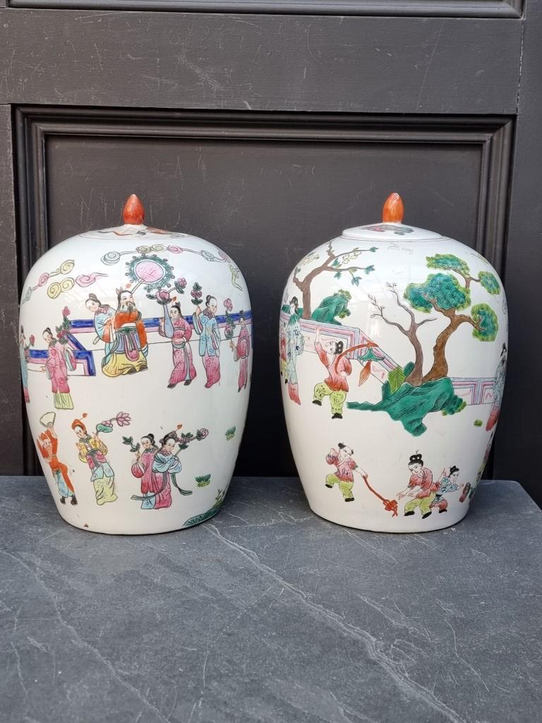 A pair of Chinese famille rose ovoid jars and covers, 31.5cm high.