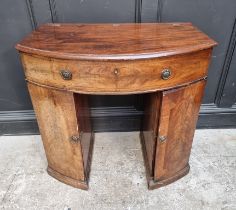 A mahogany bowfront kneehole dressing table, with hinged top, 83.5cm wide.