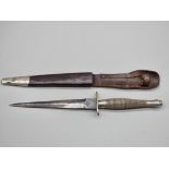 A rare circa 1940 Fairbairn-Sykes first pattern commando fighting knife and leather sheath, by
