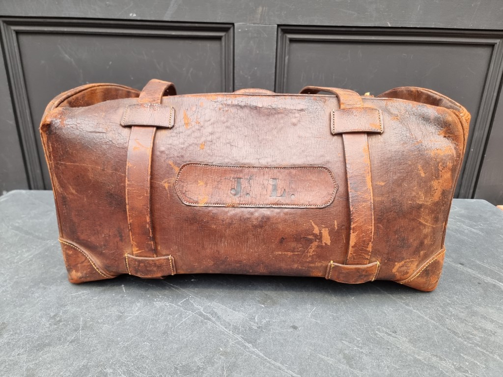 A large leather Gladstone bag.