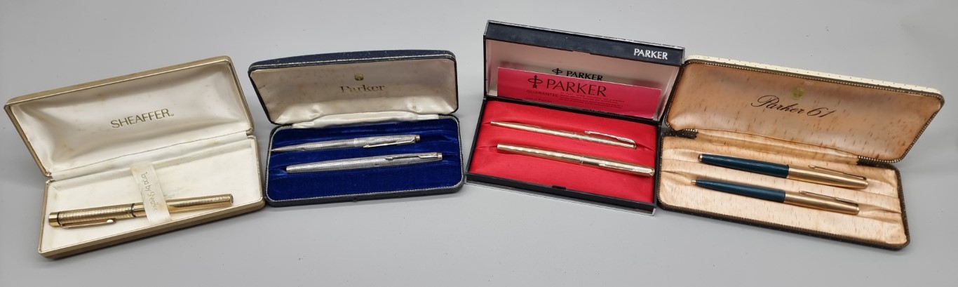 A group of vintage pens, comprising: a cased Parker silver pen set, circa 1964, (s.d. to one); a