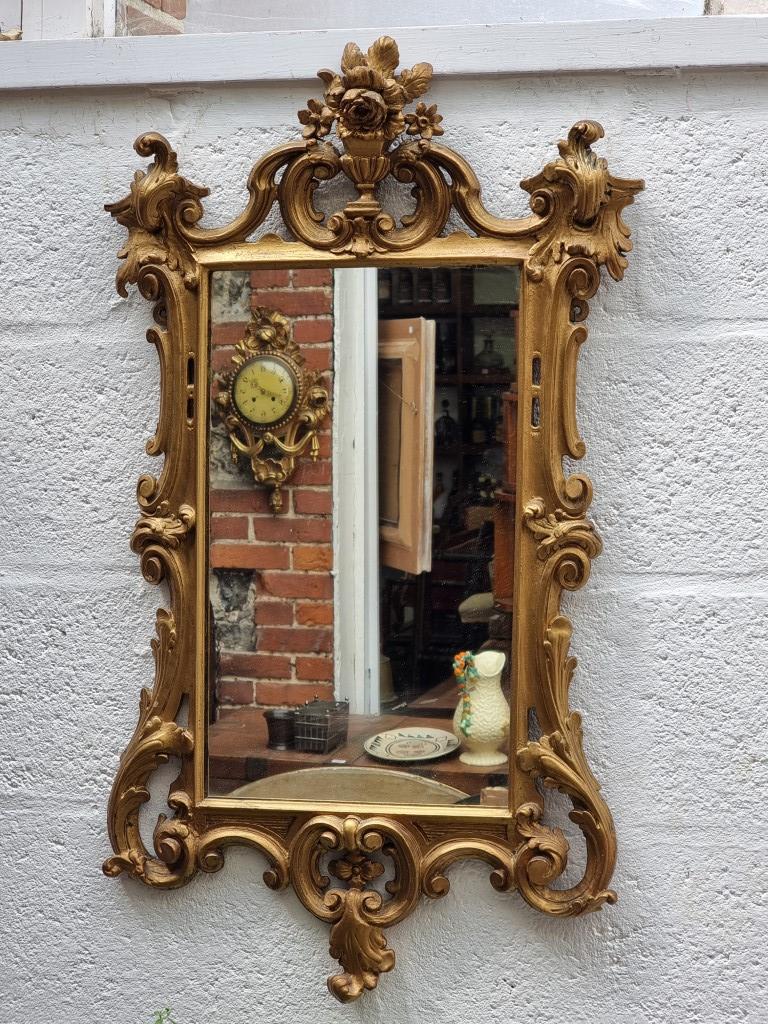 An 18th century carved giltwood framed wall mirror, 69 x 49cm.