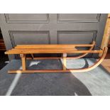 A beech and ply sled, 99cm long.