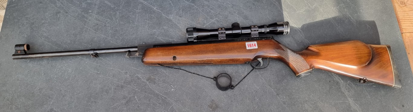 A Webley Omega .22 cal break action air rifle, Serial No.825952, with Nikko Stirling 4x32 scope.