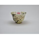 A Chinese mottled green jade bowl, 9.8cm diameter.