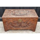 A Chinese carved camphor wood coffer, 101cm wide.