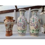 A large pair of Chinese famille rose vases, 62cm high, (star crack to base of one); together with