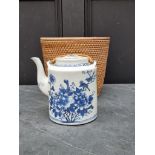 A Chinese blue & white teapot and cover, in wicker case.