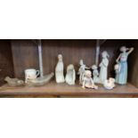 Five Lladro figures, largest 25cm high; together with two glass baby feeders; and three other items.