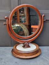 An unusual 19th century mahogany and marble toilet mirror, 61cm high.
