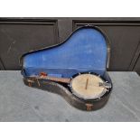 An old eight string banjo mandolin, in case.